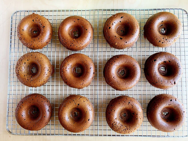 freshed baked mochi donuts on a cooling rack