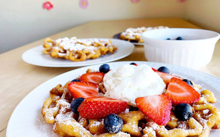 funnel cakes on plates