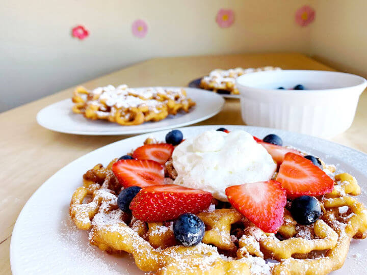 funnel cakes on plates