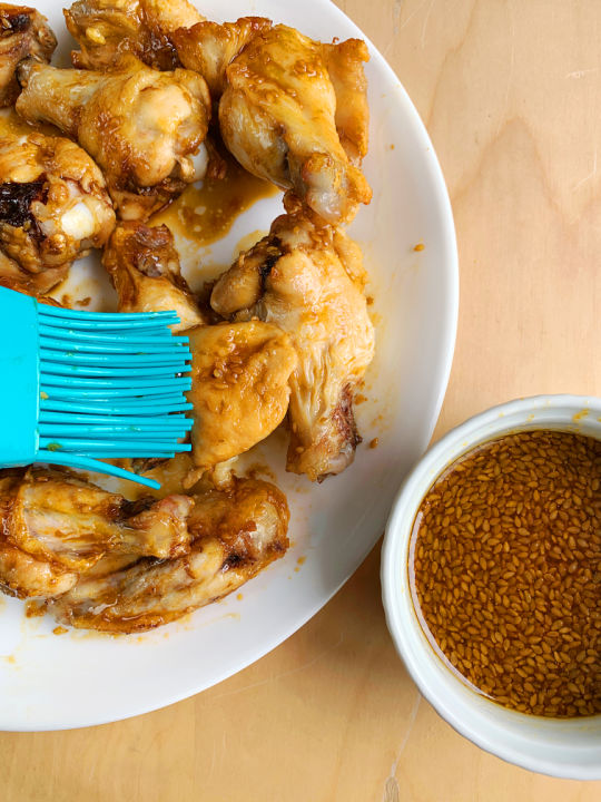 brushing marinade onto wings