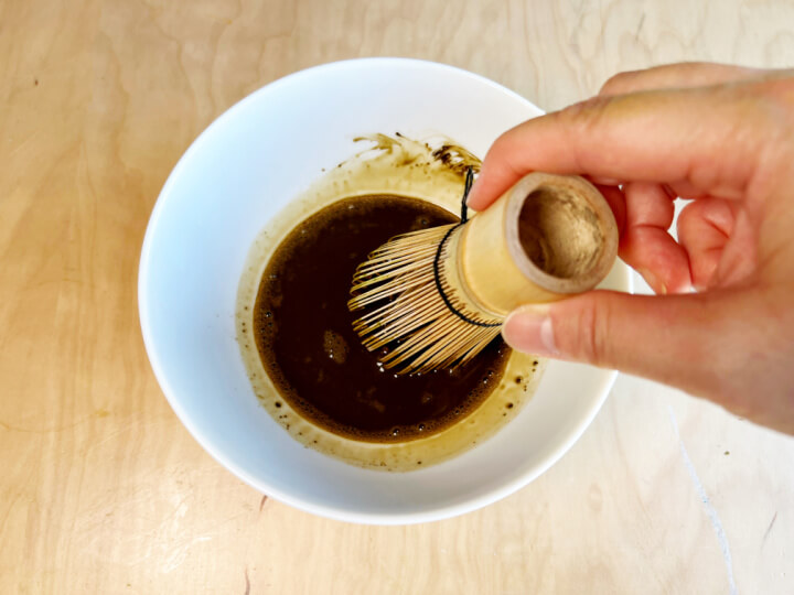 hojicha powder in a bowl being whisked