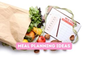 bag of fruit and vegetables and a meal planning sheet on a clipboard with a pen