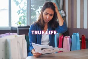 woman stressed by bills after shopping