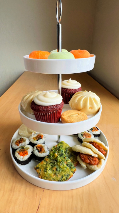 afternoon tea stand with asian food items