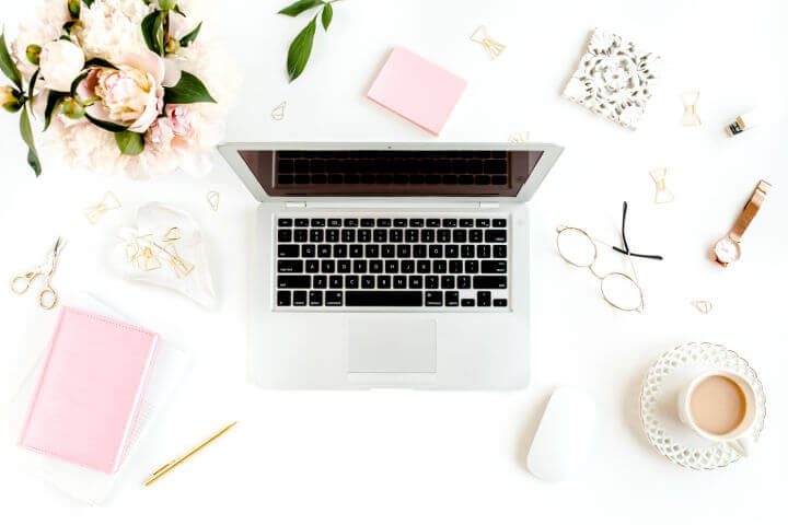 laptop on desk with office supplies